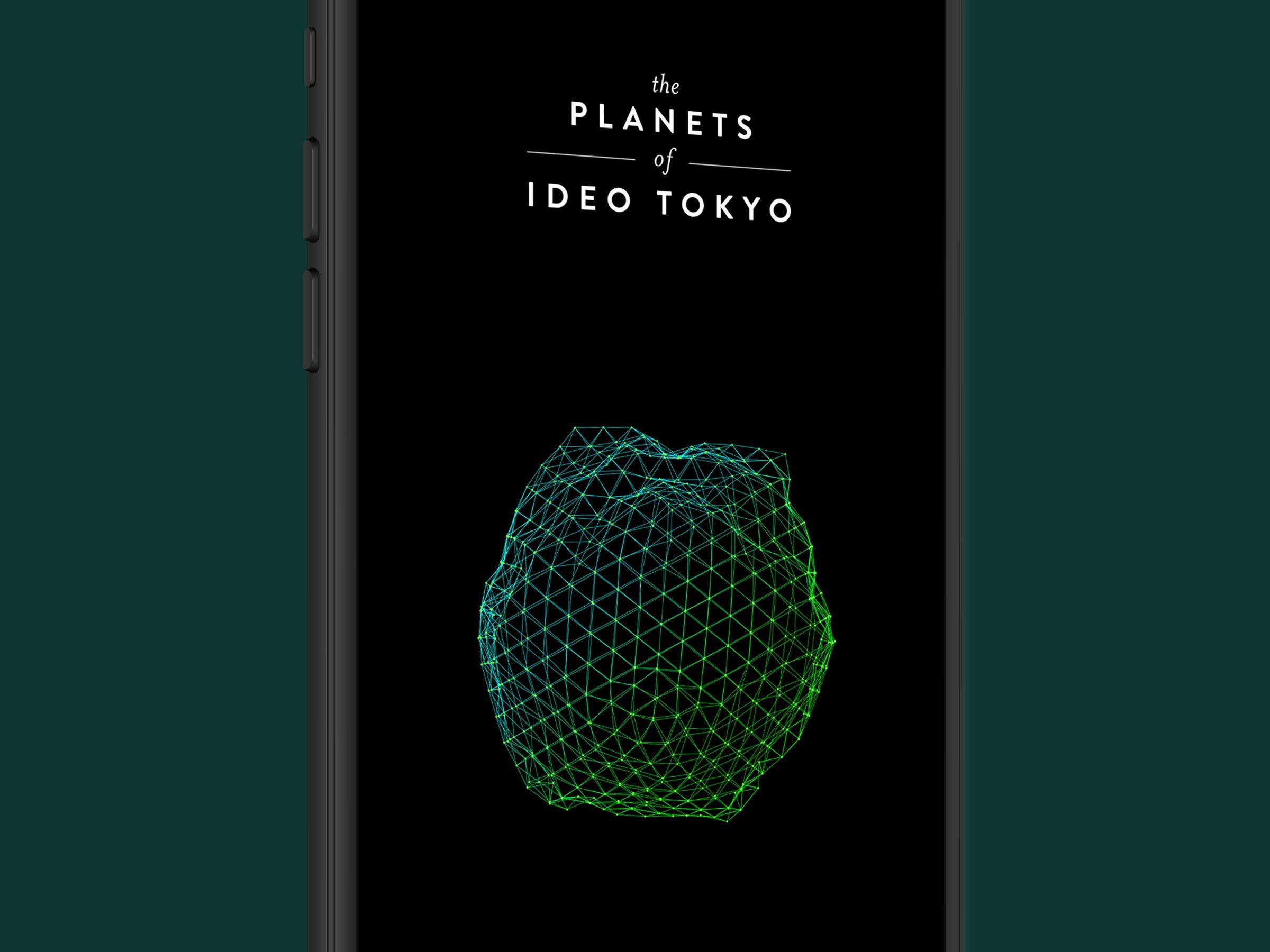 Planets of IDEO: A phone with a planet of IDEO Tokyo as its wallpaper